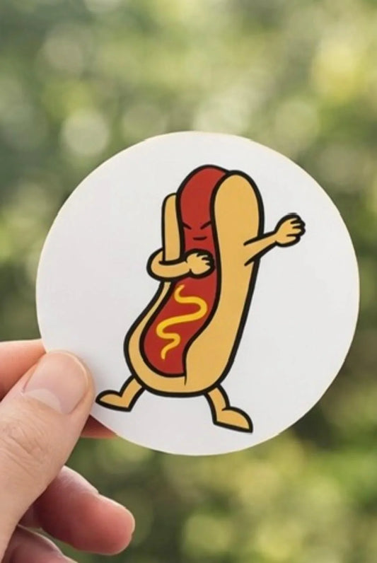 Hand holding a round sticker with a cartoon hot dog dabbing, mustard detail on sausage