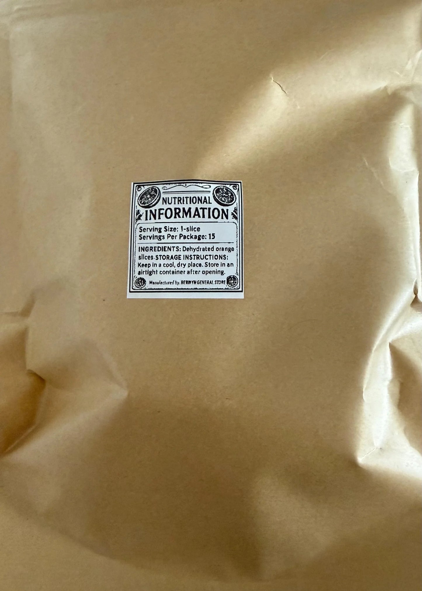 Brown package with nutritional information label for dehydrated orange slices