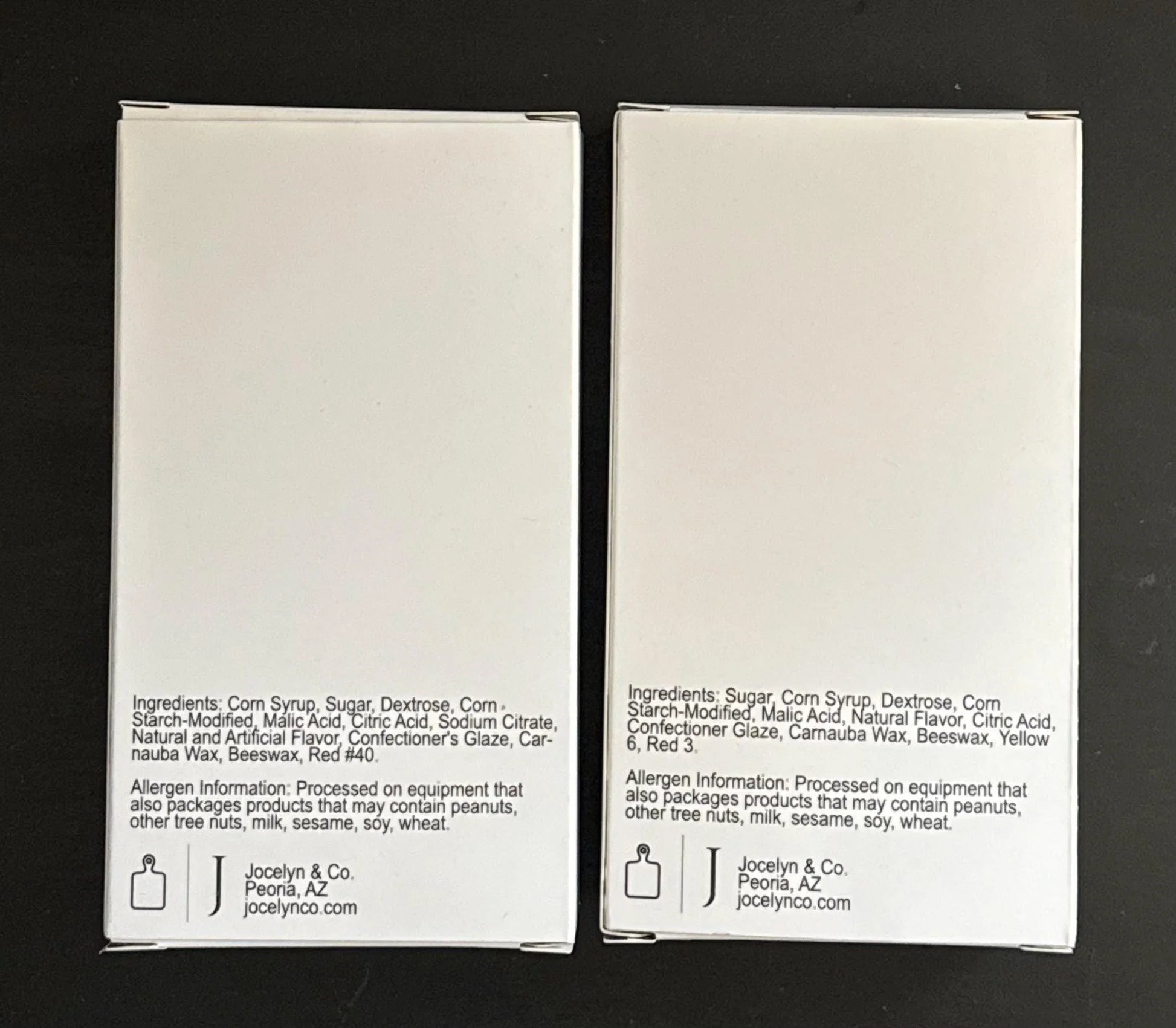 Back view of two white candy boxes with ingredients and allergen information printed on each.