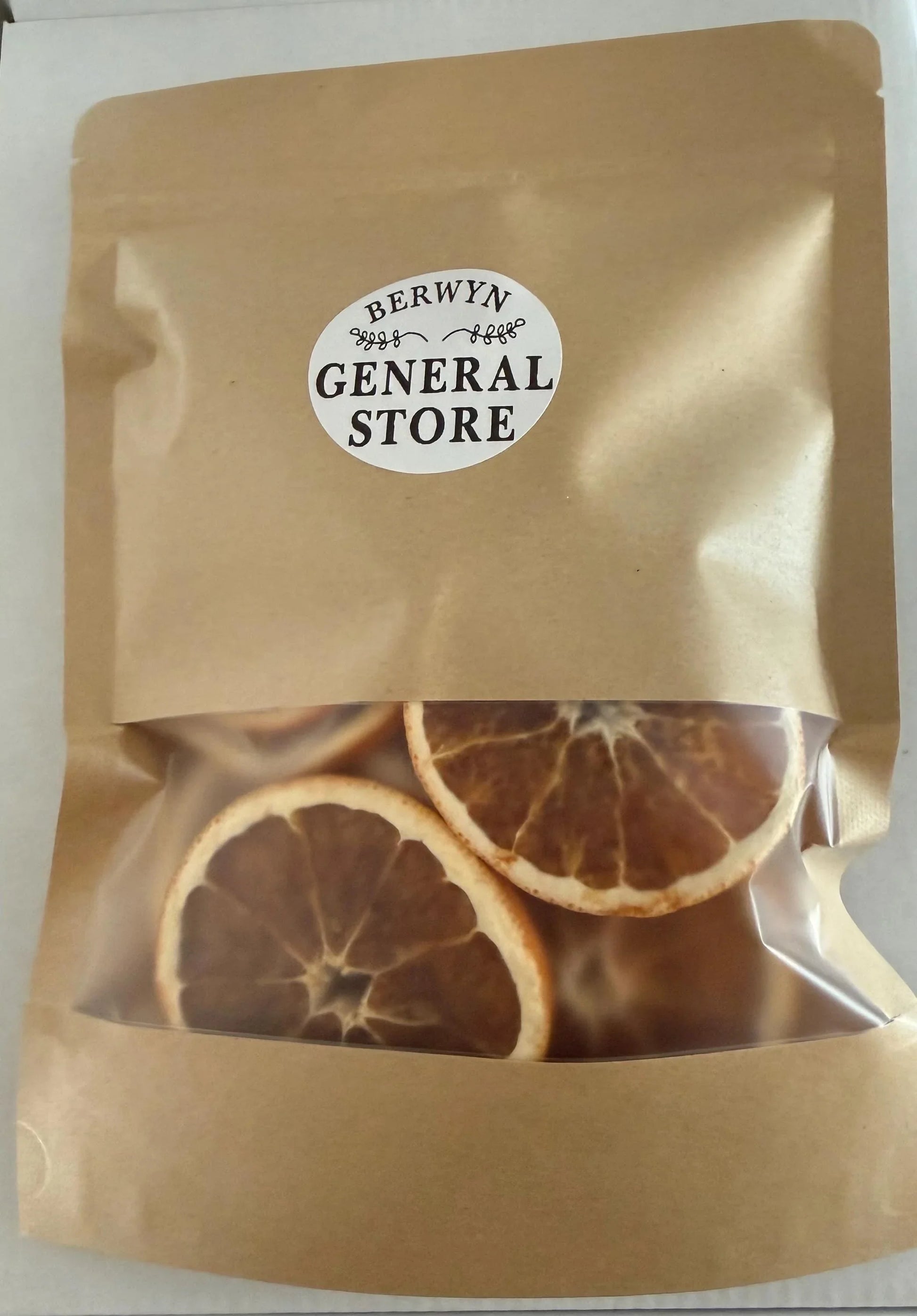 Dried orange slices in clear window kraft pouch with round label, gourmet food gift