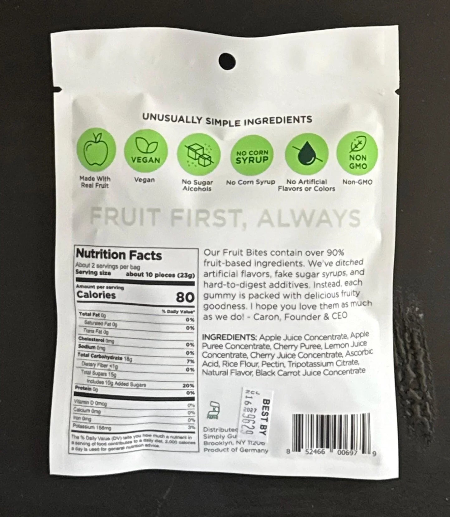 Back of vegan fruit bites package showing nutrition facts, ingredients, and dietary icons.