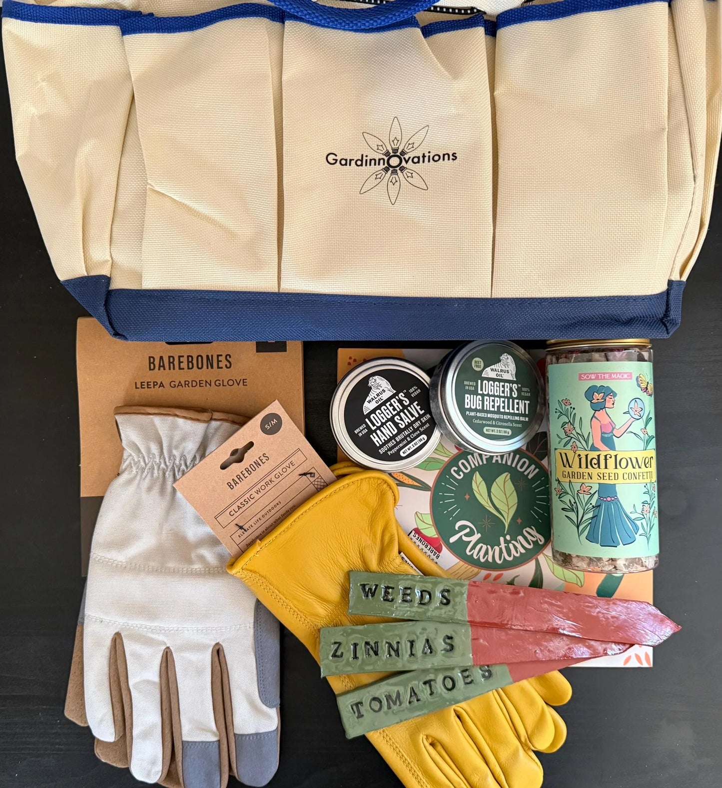 Gardening gift set with gloves, seed confetti, plant markers, hand salve, and tote bag.