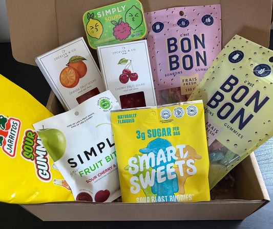 Assorted sour candy gift box with gummies, fruit sours, and artisan sweets
