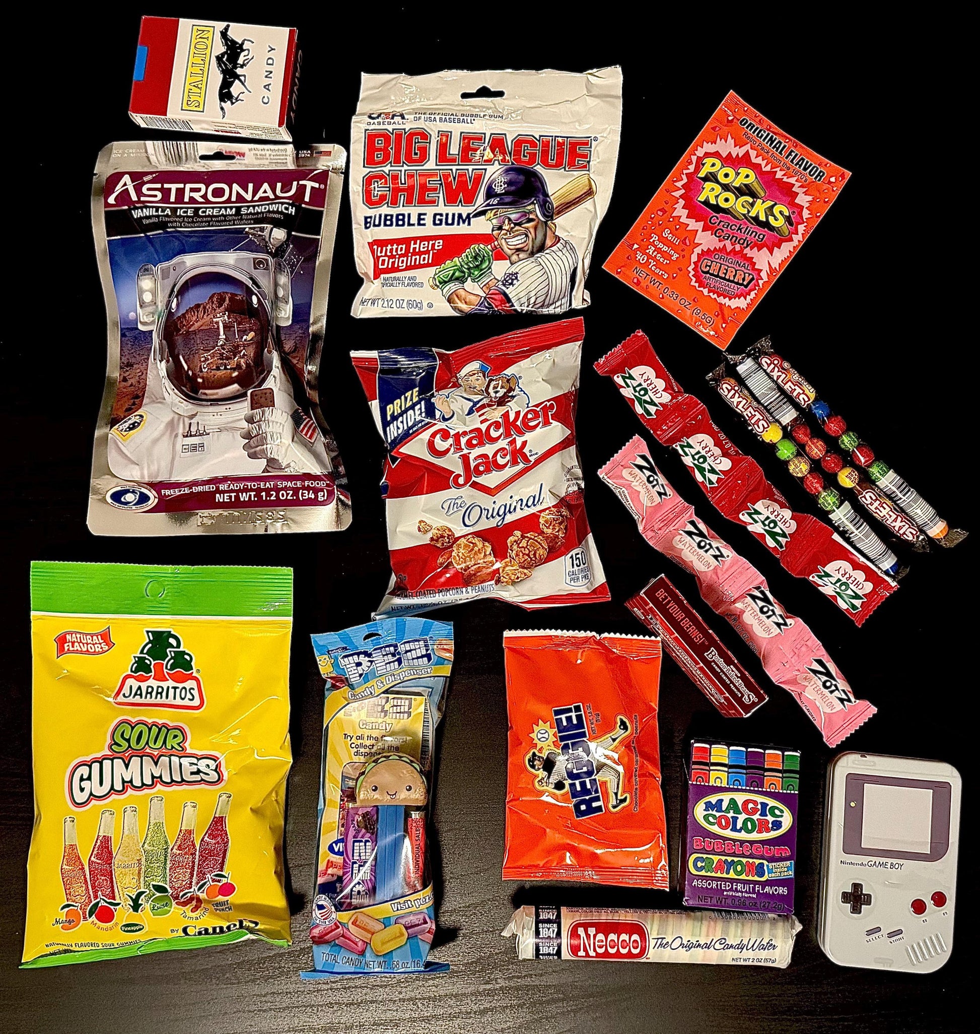 Assorted nostalgic candy, bubble gum, and snack packs arranged on a black background.